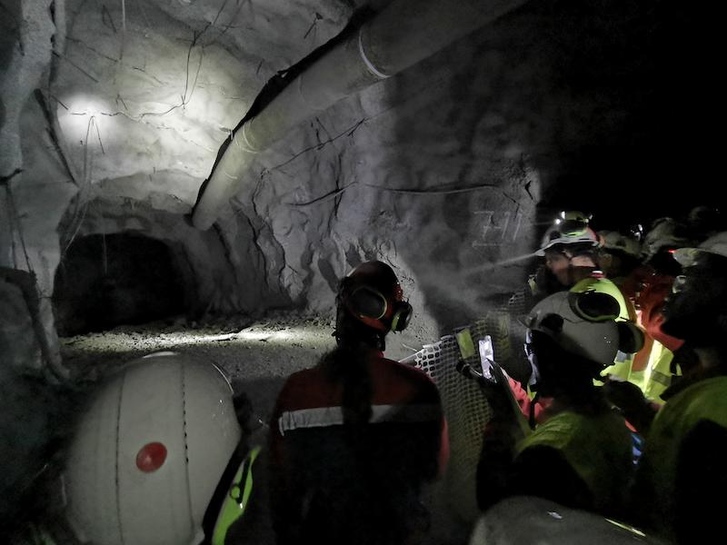 minetrain trainees looking into mine tunnel
